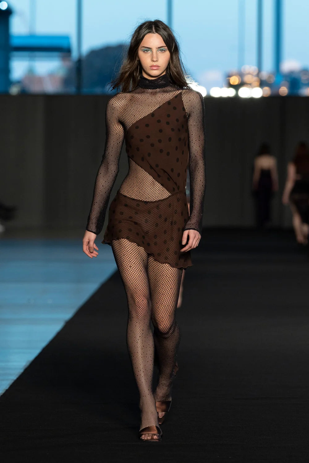 Fashion editorial featuring INSTOCK Astro crystal-embellished fishnet tights