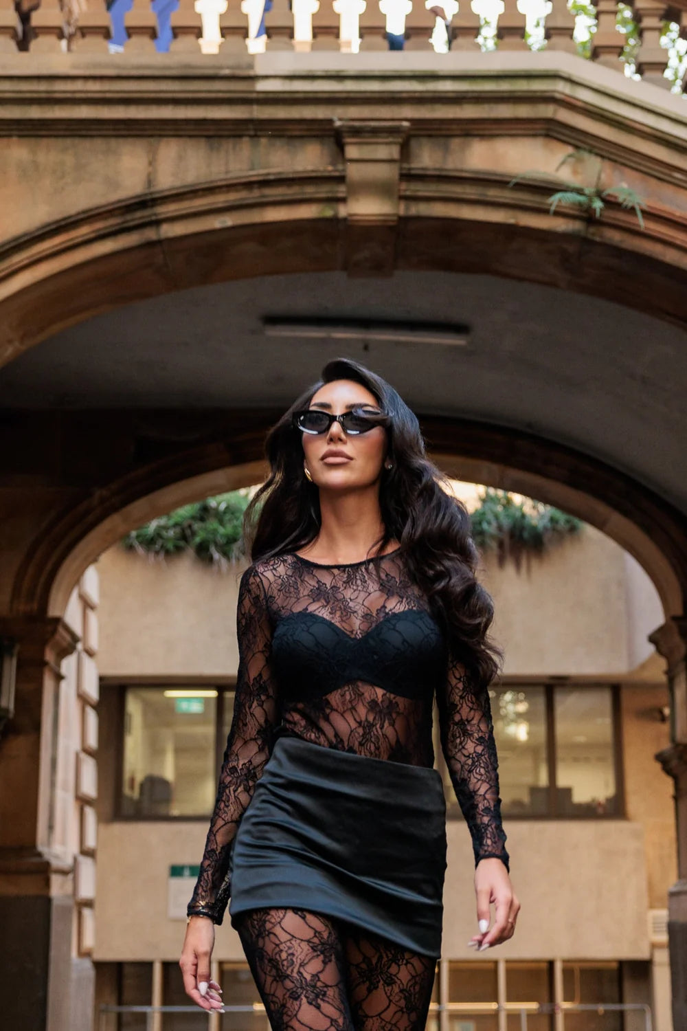 Model wearing INSTOCK Night Garden lace bodysuit